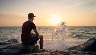 Man Sitting Next To Ocean And Contemplating What Does Weight Regain Look Like After Stopping Wegovy