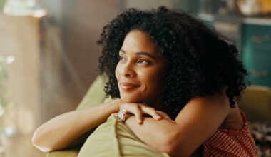Woman who started taking Sermorelin on couch calming herself after feeeling anxiety or restlessness.