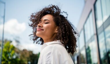 Woman happy and peaceful after seeking support for hormonal balance through peptide therapy. Oxytocin, PCOS Support & Perimenopause Care.