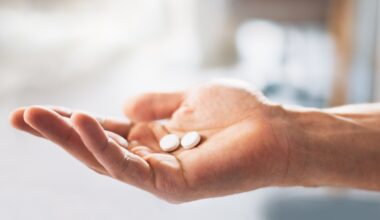 A person holding their pills. They are in the process of increasing their dose for their Wegovy pill