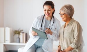 Doctor speaking to a patient. They are explaining longevity treatments and how they work.