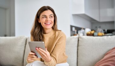 older woman using digital tablet at home. They are using zepbound to while in perimenopause/menopause