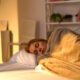 A woman getting a good nights rest when using NAD+ for improved sleep benefits.