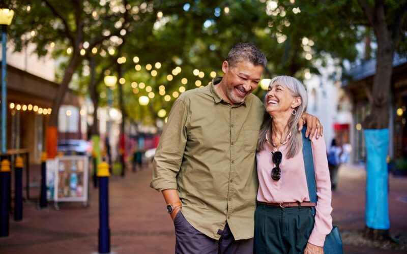 An older couple walking after boosting their metabolism through NAD+ therapy and medication.