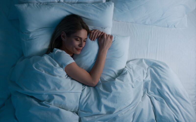 After using B12 injections, a comfortable woman sleeps better and wakes up feeling more rested and energized.